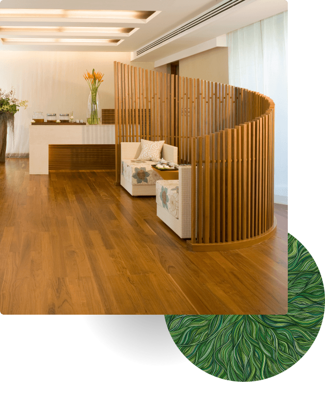 Modern lounge with wooden divider and seating area on wood floor.